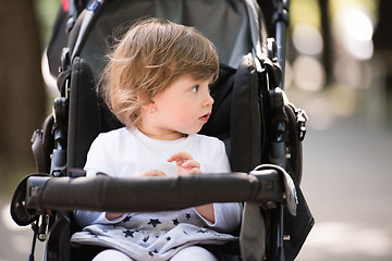 Image showing baby girl sitting in the pram