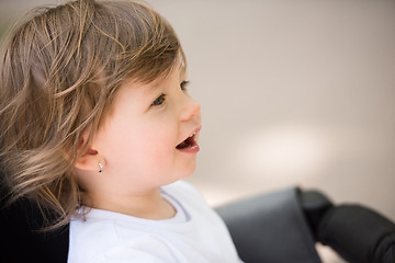 Image showing baby girl sitting in the pram