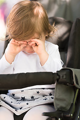 Image showing baby girl sitting in the pram