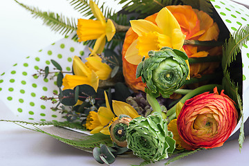 Image showing Ranunkulyus bouquet of red flowers on a white background