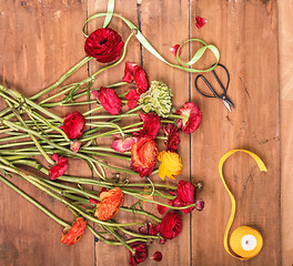 Image showing Ranunkulyus bouquet of red flowers on a white background