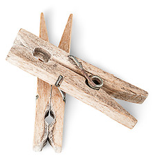 Image showing Two old wooden clothespins on each other