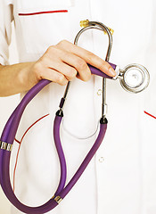 Image showing Close-up of female doctor holding stethoscope 