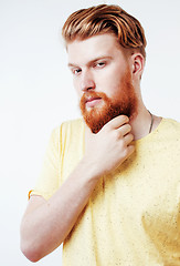 Image showing young handsome hipster ginger bearded guy looking brutal isolated on white background, lifestyle people concept