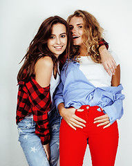 Image showing lifestyle and people concept: Fashion portrait of two stylish sexy girls best friends, over white background. Happy time for fun. 