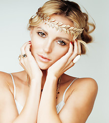 Image showing young blond woman dressed like ancient greek godess, gold jewelry close up isolated, beautiful girl hands manicured red nails