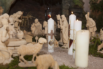 Image showing Baptismal candles in a crib