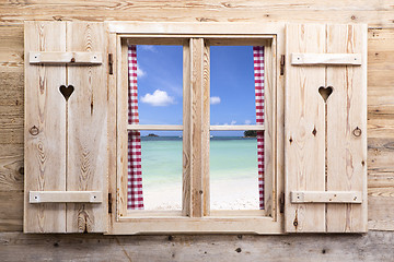 Image showing Wooden window with beach panorama view