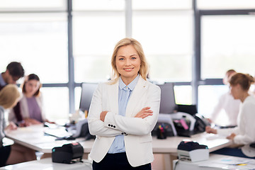 Image showing smiling businesswoman at office