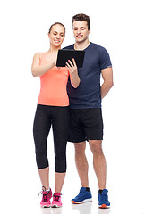 Image showing happy sportive man and woman with tablet pc