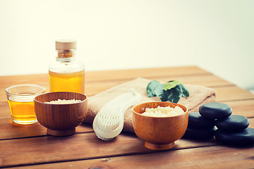 Image showing close up of scrub, massage oil and bath stuff