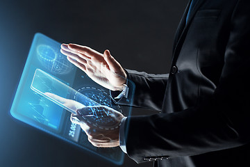 Image showing close up of businessman with transparent tablet pc