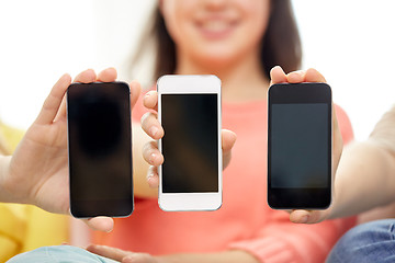 Image showing happy women or teenage girls with smartphones