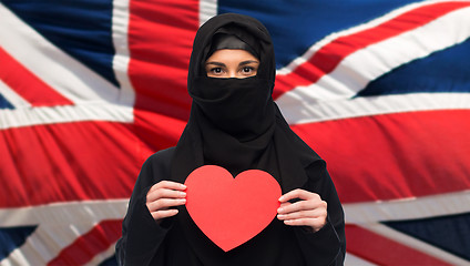 Image showing muslim woman in hijab holding red heart