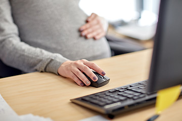 Image showing pregnant businesswoman with computer at office