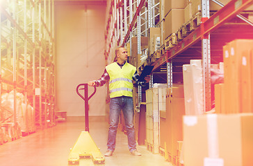 Image showing man with loader and clipboard at warehouse