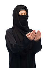 Image showing praying muslim woman in hijab over white