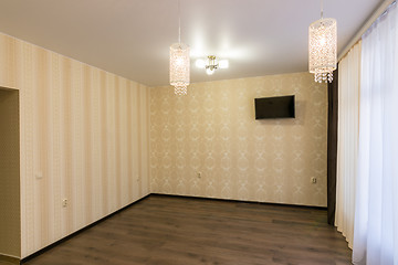Image showing The interior of an empty renovated room, hangs on the wall TV