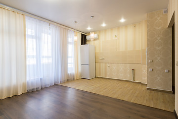 Image showing Interior renovated kitchen combined with a living room, unfurnished