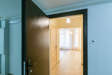 Image showing The open front door in renovated apartment in new building