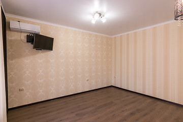 Image showing Interior of an empty room, the wall split system and TV