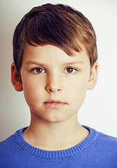 Image showing young pretty little cute boy kid wondering, posing emotional face isolated on white background, gesture happy smiling close up, lifestyle people concept