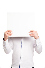 Image showing close up of man hands showing white blank board