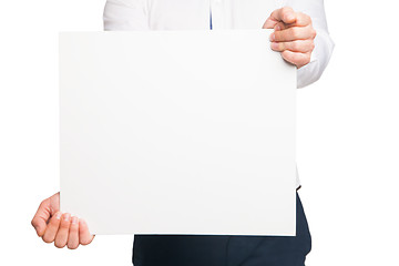 Image showing close up of man hands showing white blank board