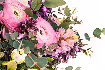 Image showing Ranunkulyus bouquet of red flowers on a white background