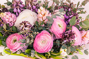 Image showing Ranunkulyus bouquet of red flowers on a white background