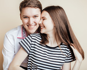 Image showing couple of happy smiling teenagers students, warm colors having a kiss, lifestyle people concept, boy and girl together 