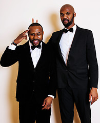 Image showing two afro-american businessmen in black suits emotional posing, g