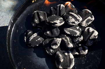 Image showing close up of charcoal briquettes with flames