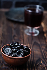 Image showing drink and dry plums