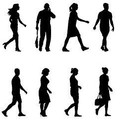 Image showing Set black silhouettes of beautiful man and woman on white background. illustration