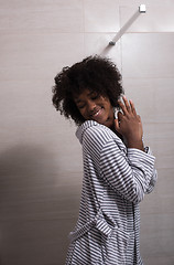 Image showing beautiful black woman wearing  bathrobe