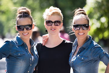 Image showing portrait of three young beautiful woman with sunglasses