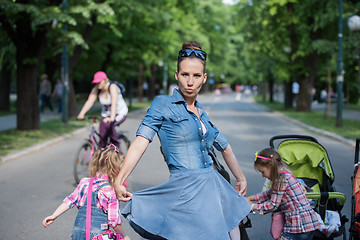 Image showing mother with her daughters in the park