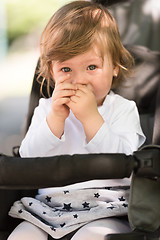 Image showing baby girl sitting in the pram