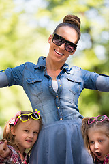 Image showing mother with her daughters in the park