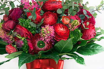 Image showing Ranunkulyus bouquet of red flowers on a white background