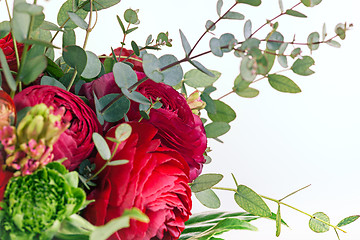 Image showing Ranunkulyus bouquet of red flowers on a white background