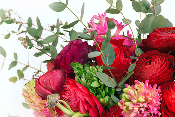 Image showing Ranunkulyus bouquet of red flowers on a white background