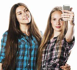 Image showing cute teenage girls making selfie isolated