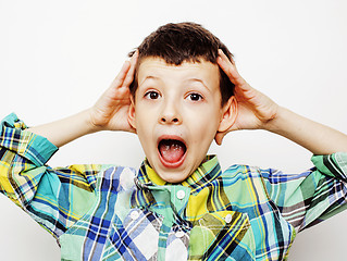 Image showing young pretty little cute boy kid wondering, posing emotional face isolated on white background, gesture happy smiling close up, lifestyle people concept