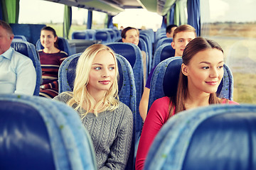 Image showing happy young women riding in travel bus