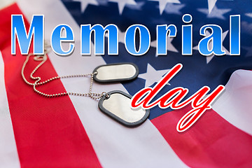 Image showing memorial day words over american flag and dog tags