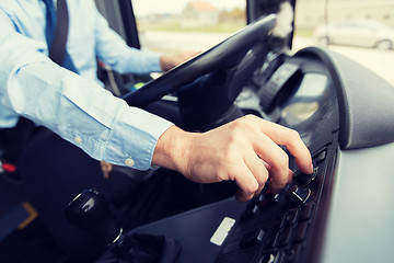 Image showing close up of driver driving passenger bus