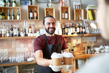 Image showing man or waiter serving customer in coffee shop