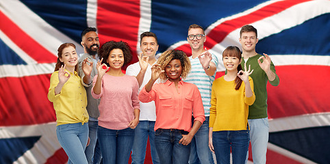 Image showing international people showing ok over british flag